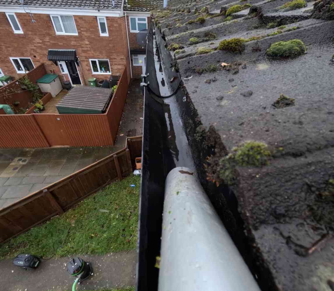 Professional gutter cleaning in action
