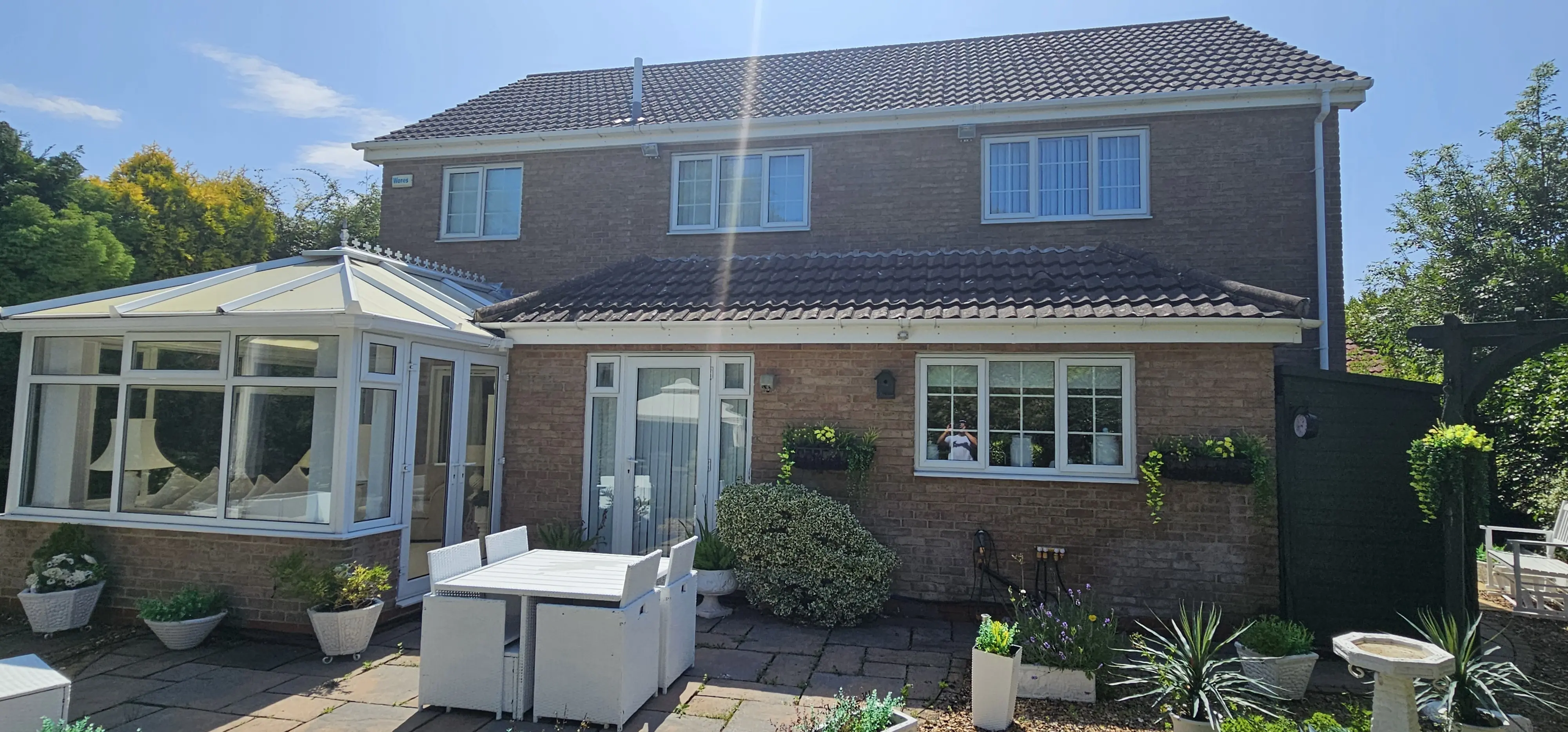 Professional Window Cleaner at Work